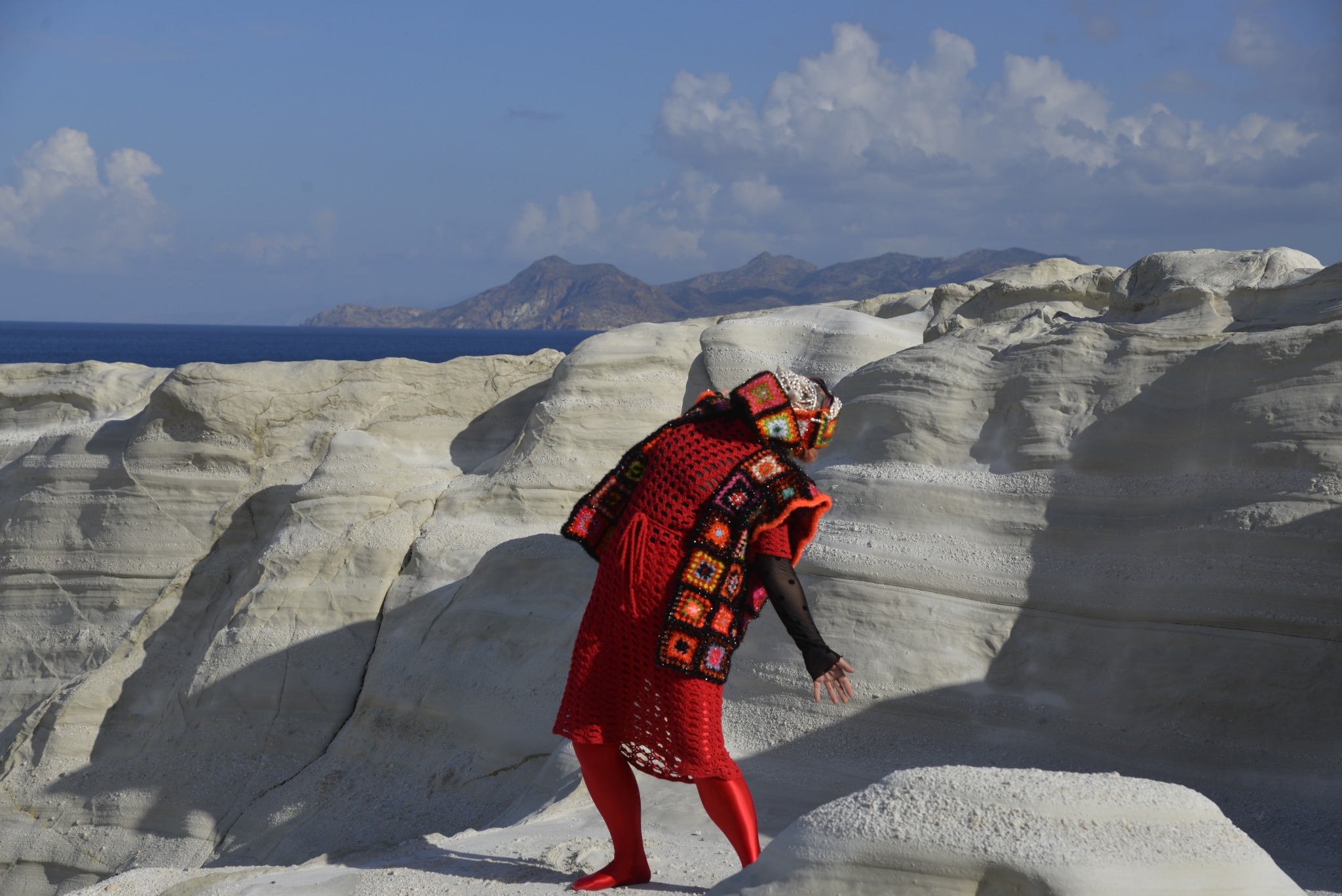 Red beetle figure among the white rocks