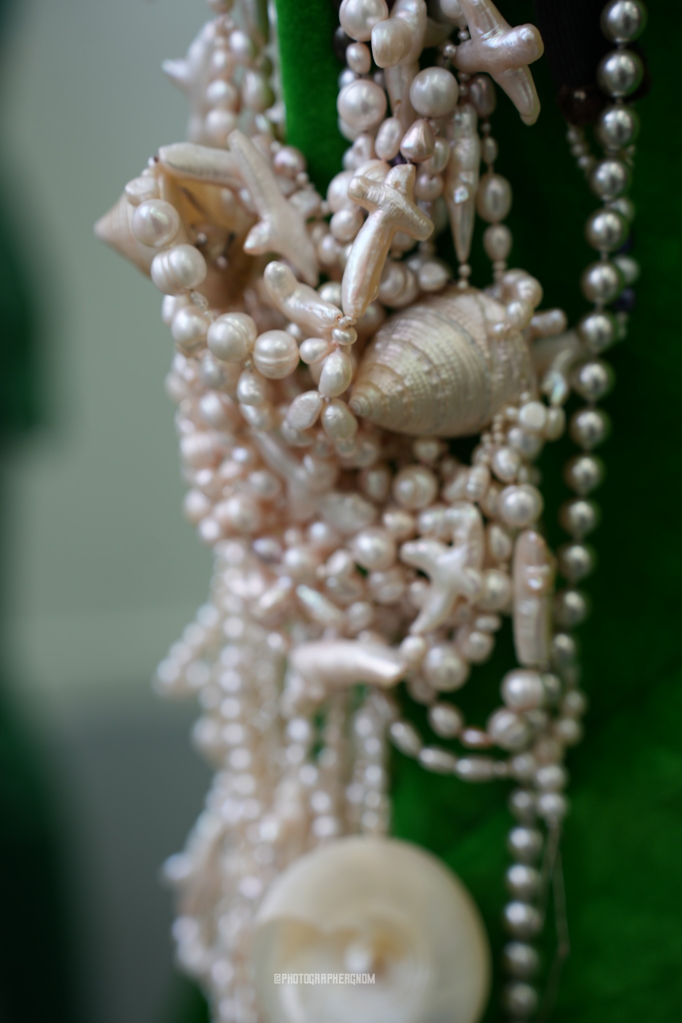 Pearls and shells hanging from a costume