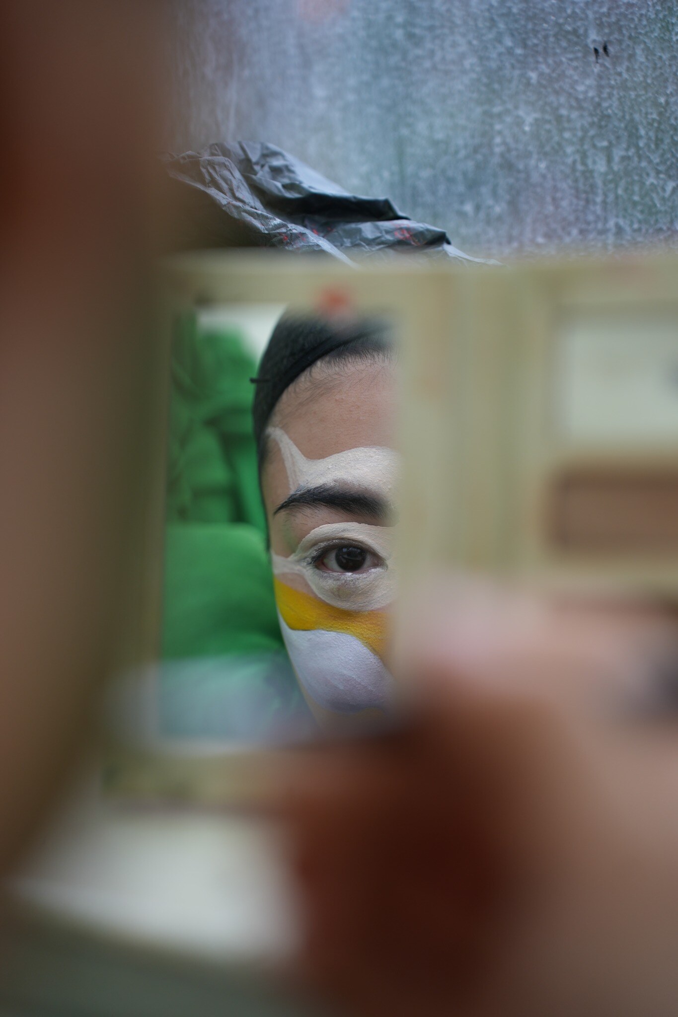 Performer applying makeup before FROM VENUS — LIVE