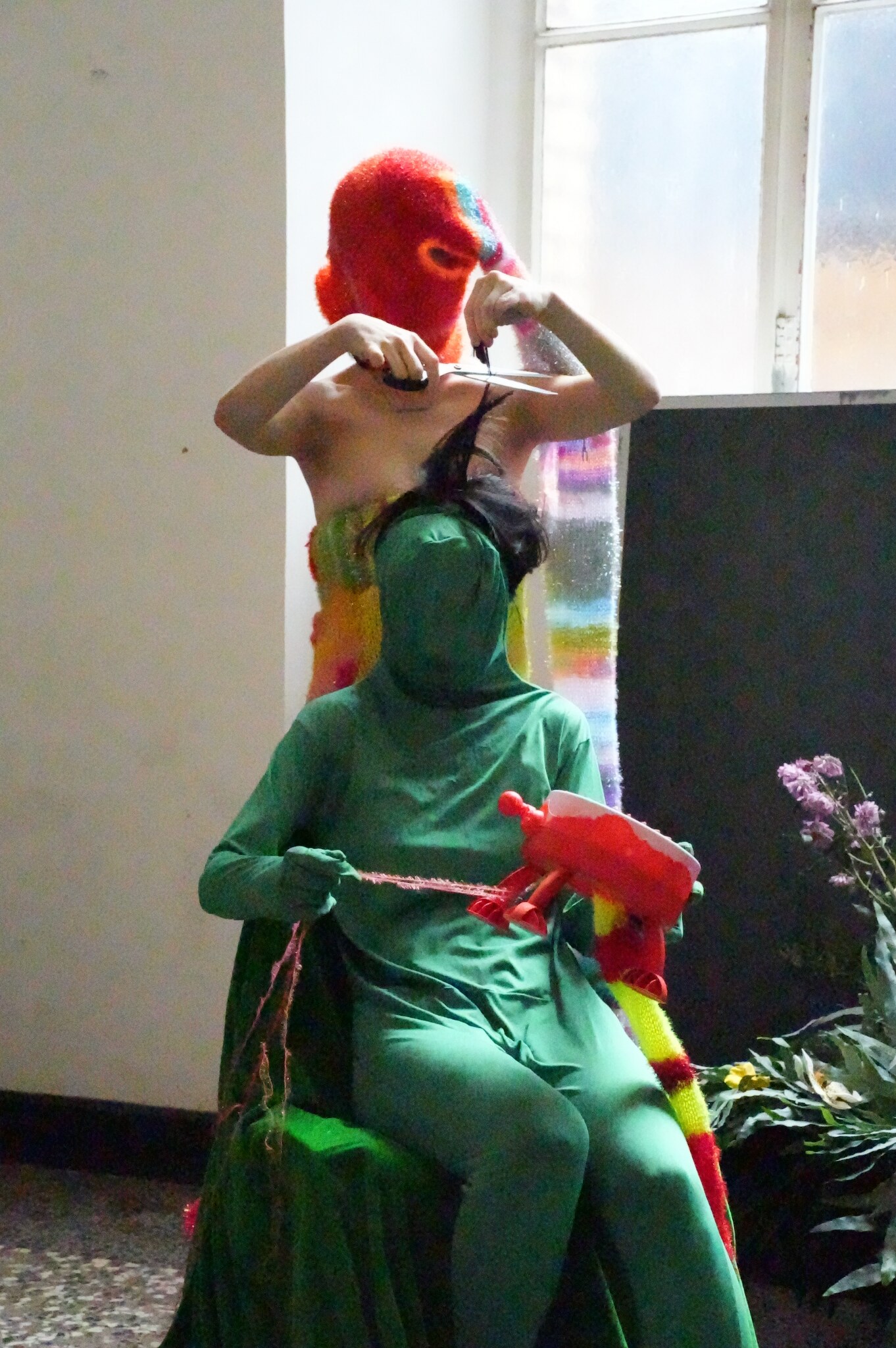 Costumed figures moving through a staged fight