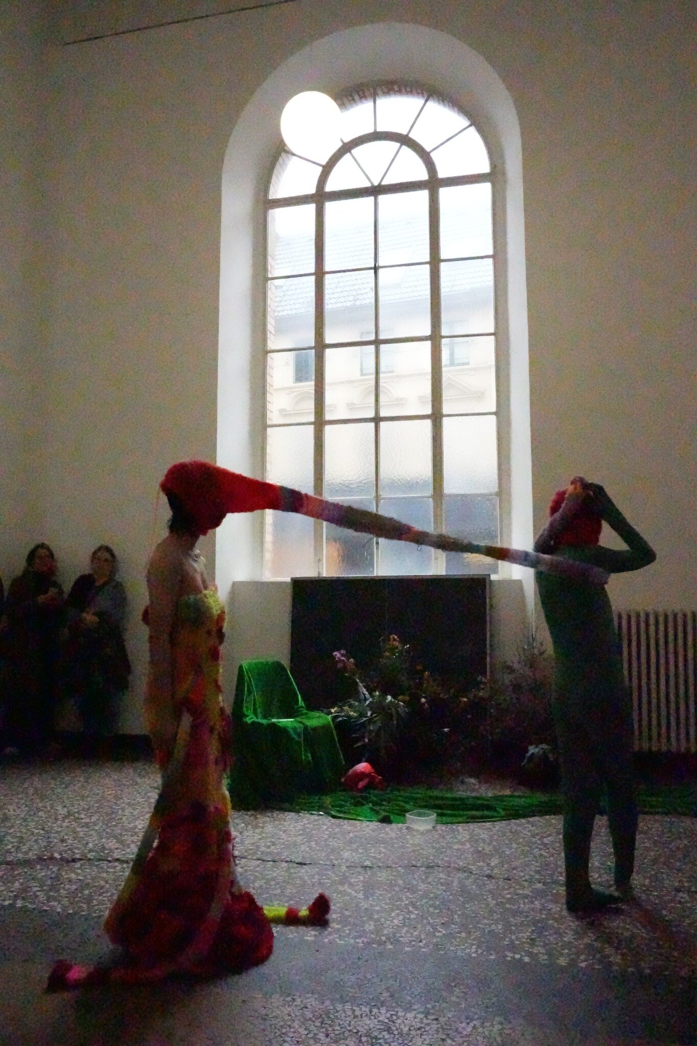 Coral figure performing before an audience