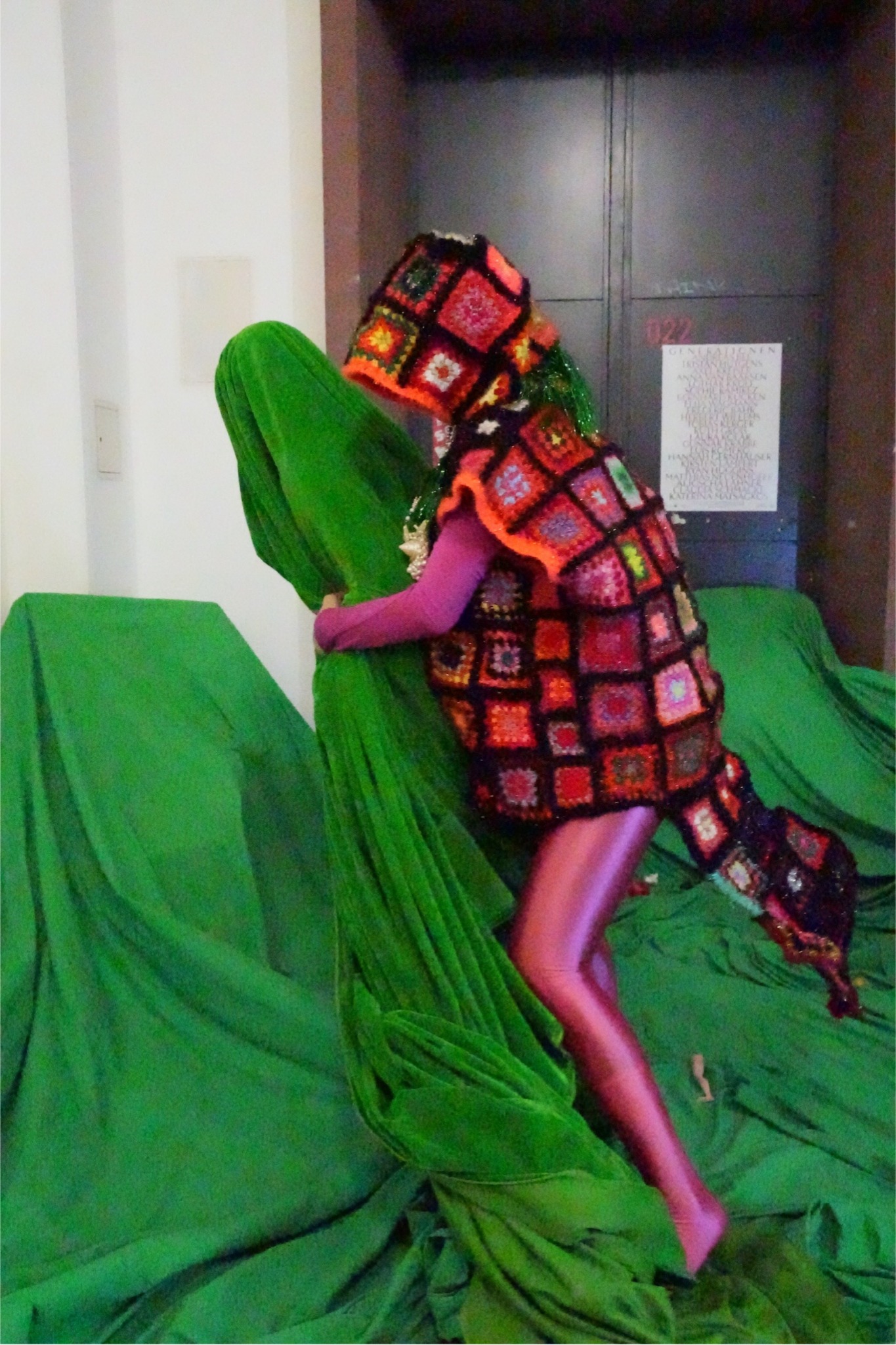 Red beetle figure moving across the green structure