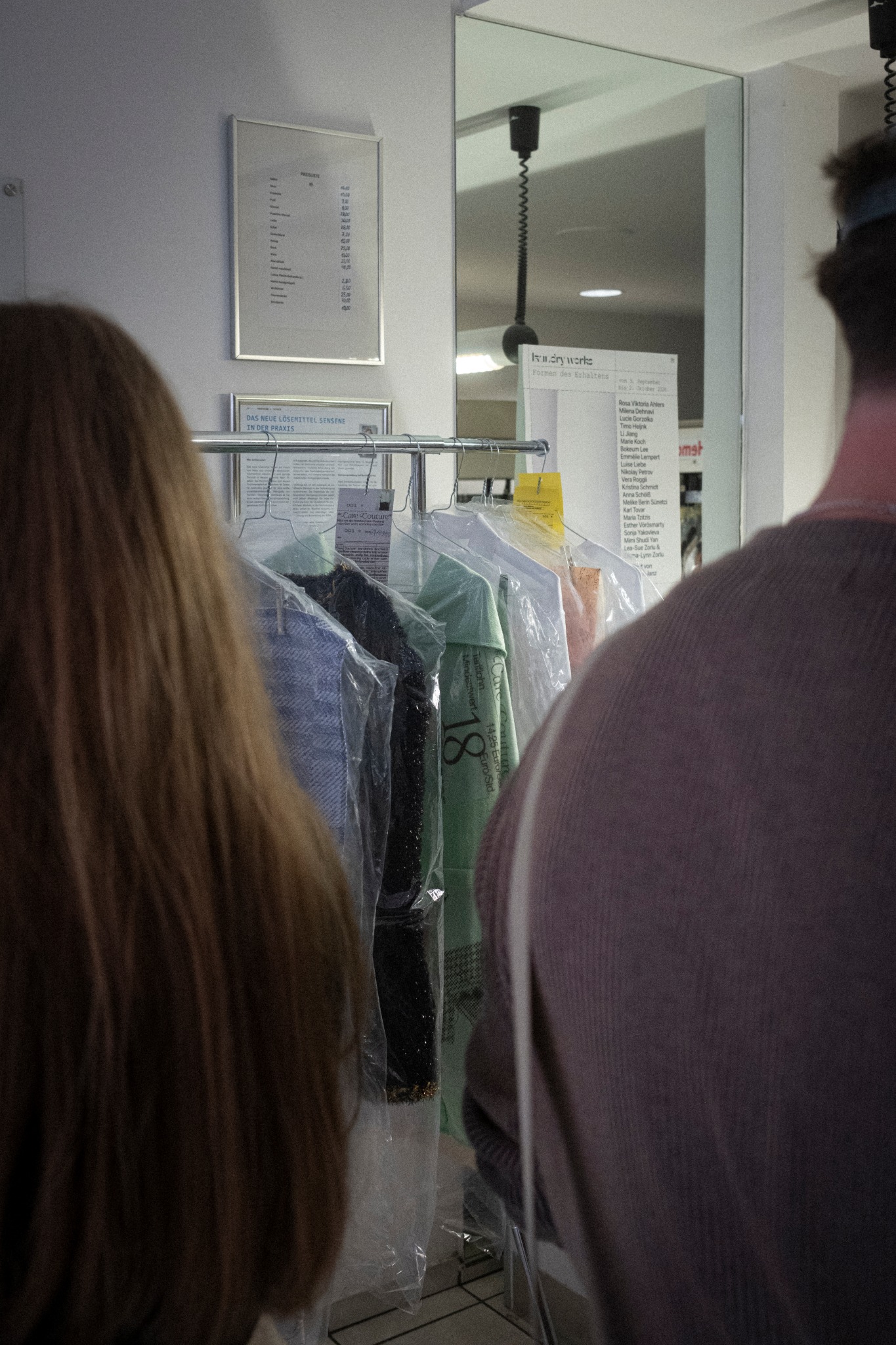 Visitors viewing the works inside City Reinigung