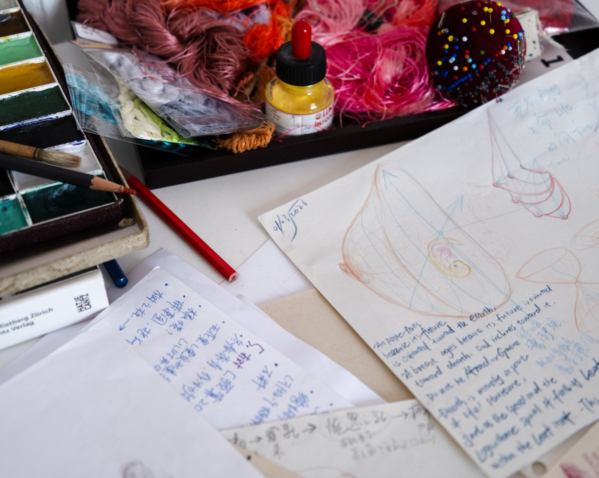 Watercolors, notes and material samples used during research